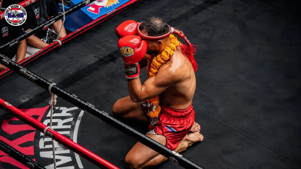 Muay Thai fighter performing the Wai Kru ritual at Bangla Stadium Patong