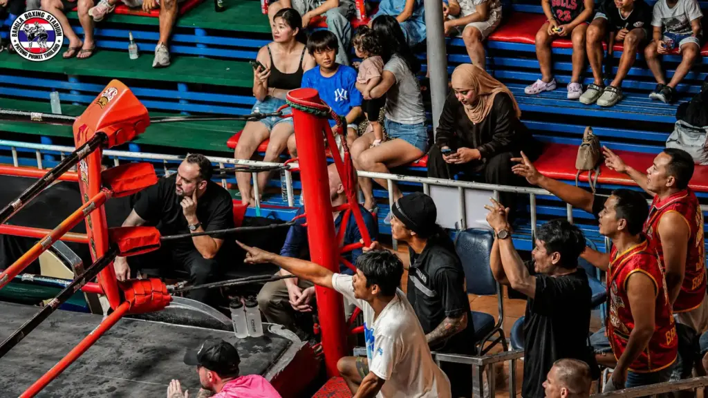 Audience and coaches at a Phuket Muay Thai stadium