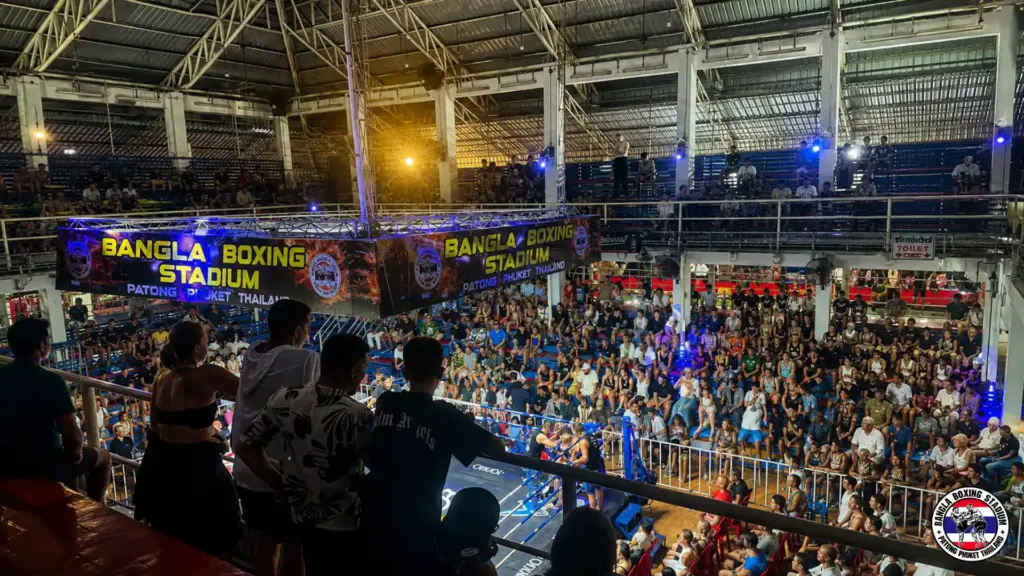 Spectators viewing Phuket Muay Thai fights inside Bangla Boxing Stadium.