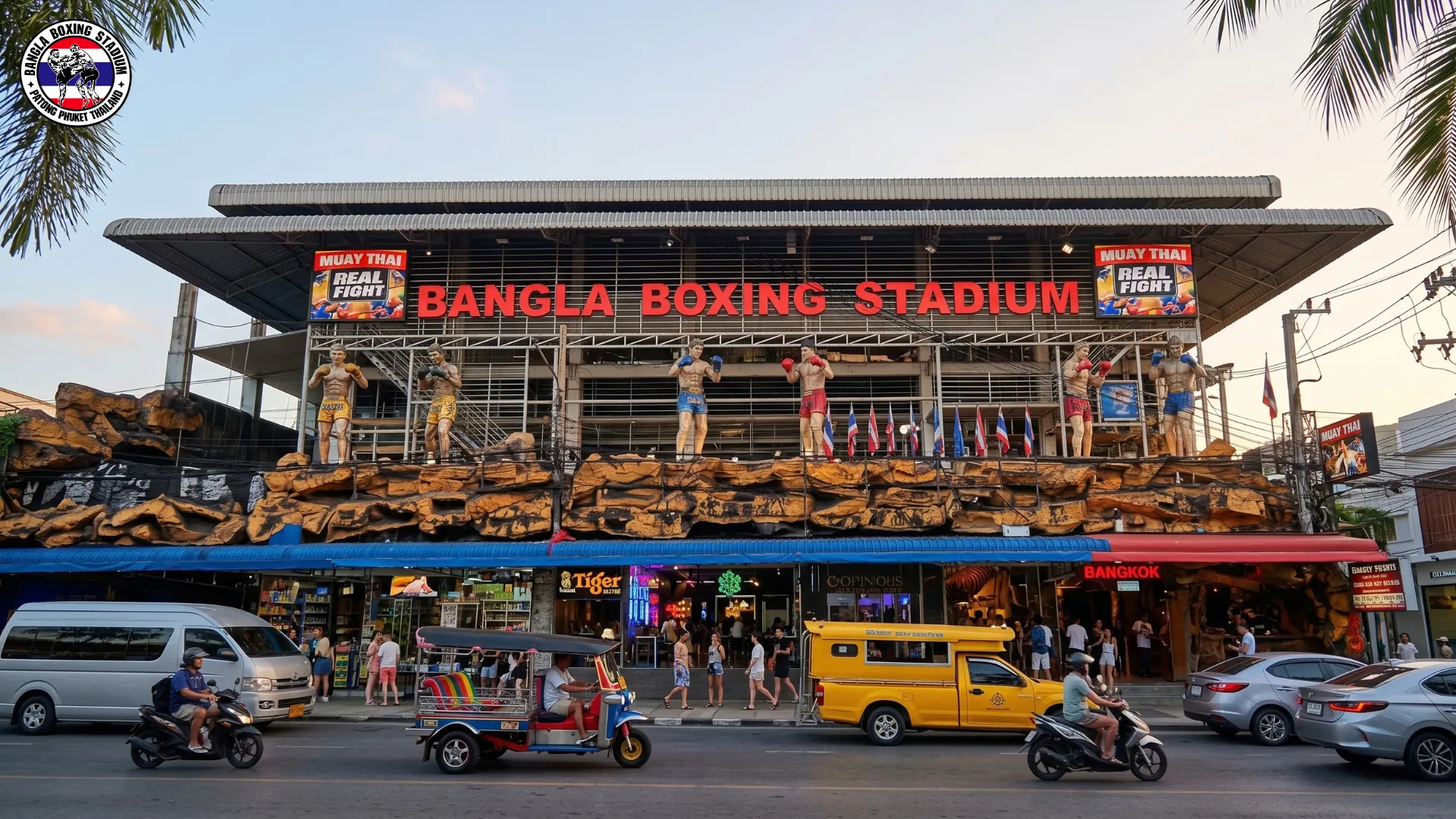 Tuk tuk passing the Bangla Boxing Stadium entrance in Patong