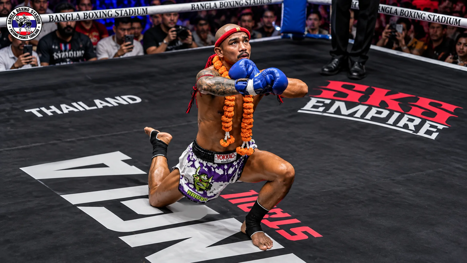Muay Thai fighter wearing a mongkol and flower garland during the Wai Kru