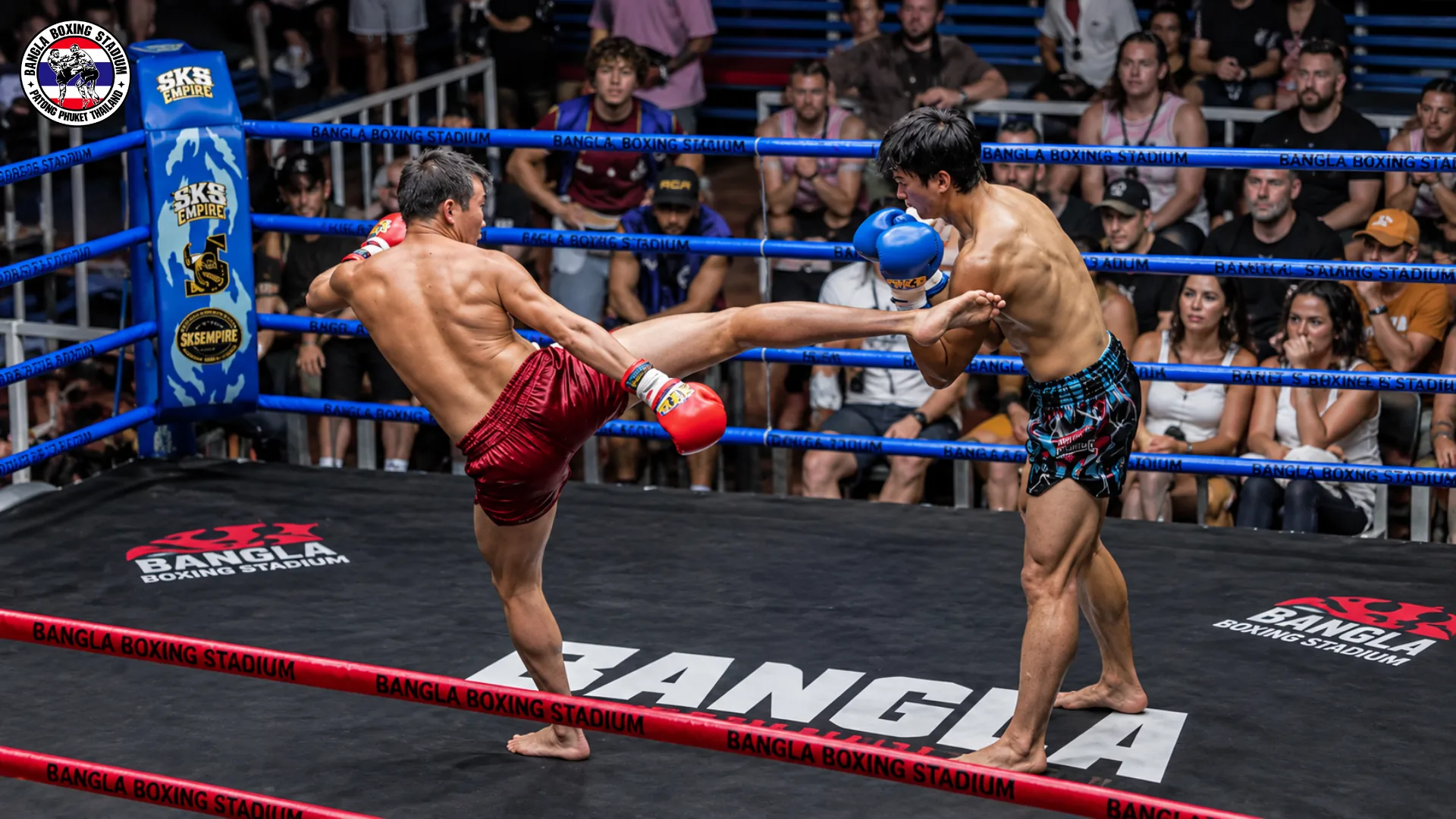 Two Muay Thai fighters trading kicks in the ring at Bangla Boxing Stadium