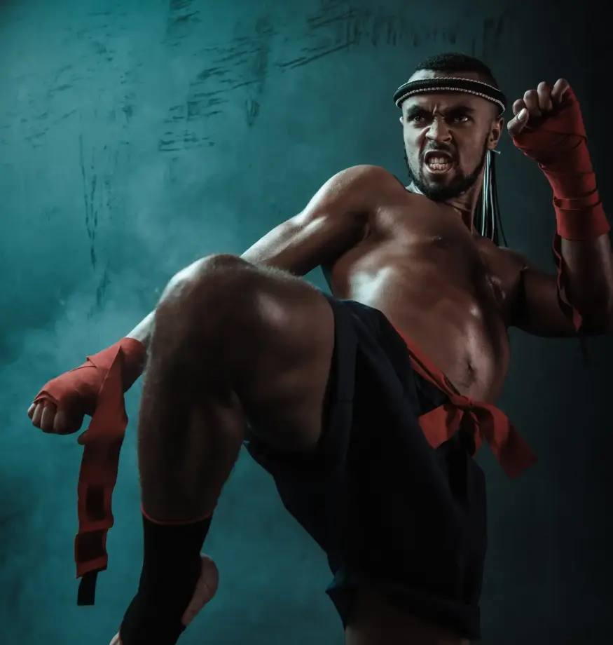 low-angle-view-of-determined-muay-thai-fighter-tra-2024-11-19-17-28-37-utc-min