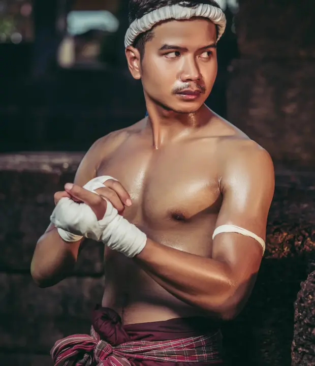 the-boxer-sat-on-the-stone-tied-the-tape-around-h-2025-01-16-13-55-56-utc-min